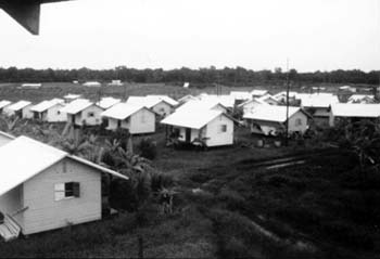 Rows of white houses in Jonestown
